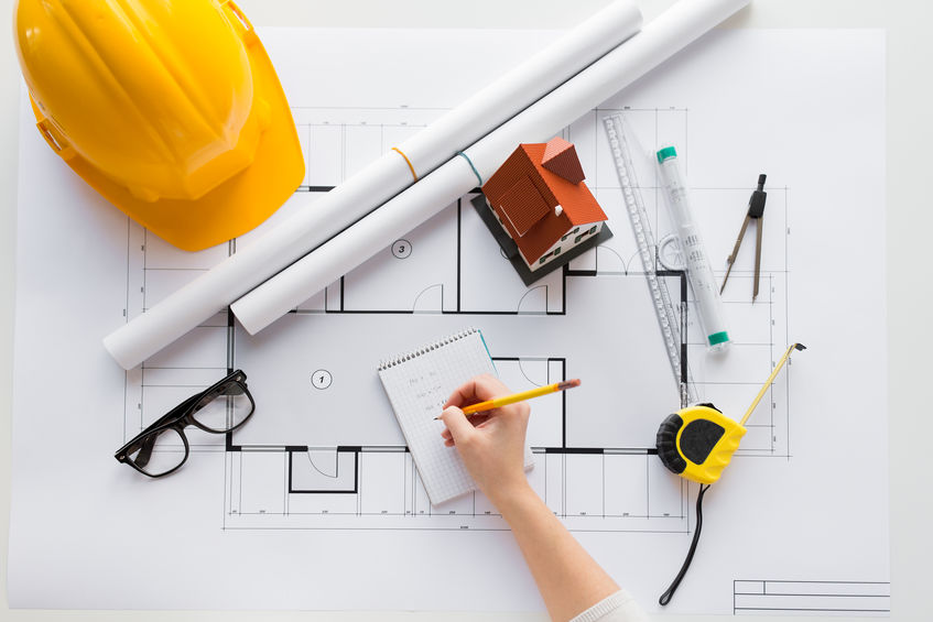 close up of architect hand with blueprint 61180748 s